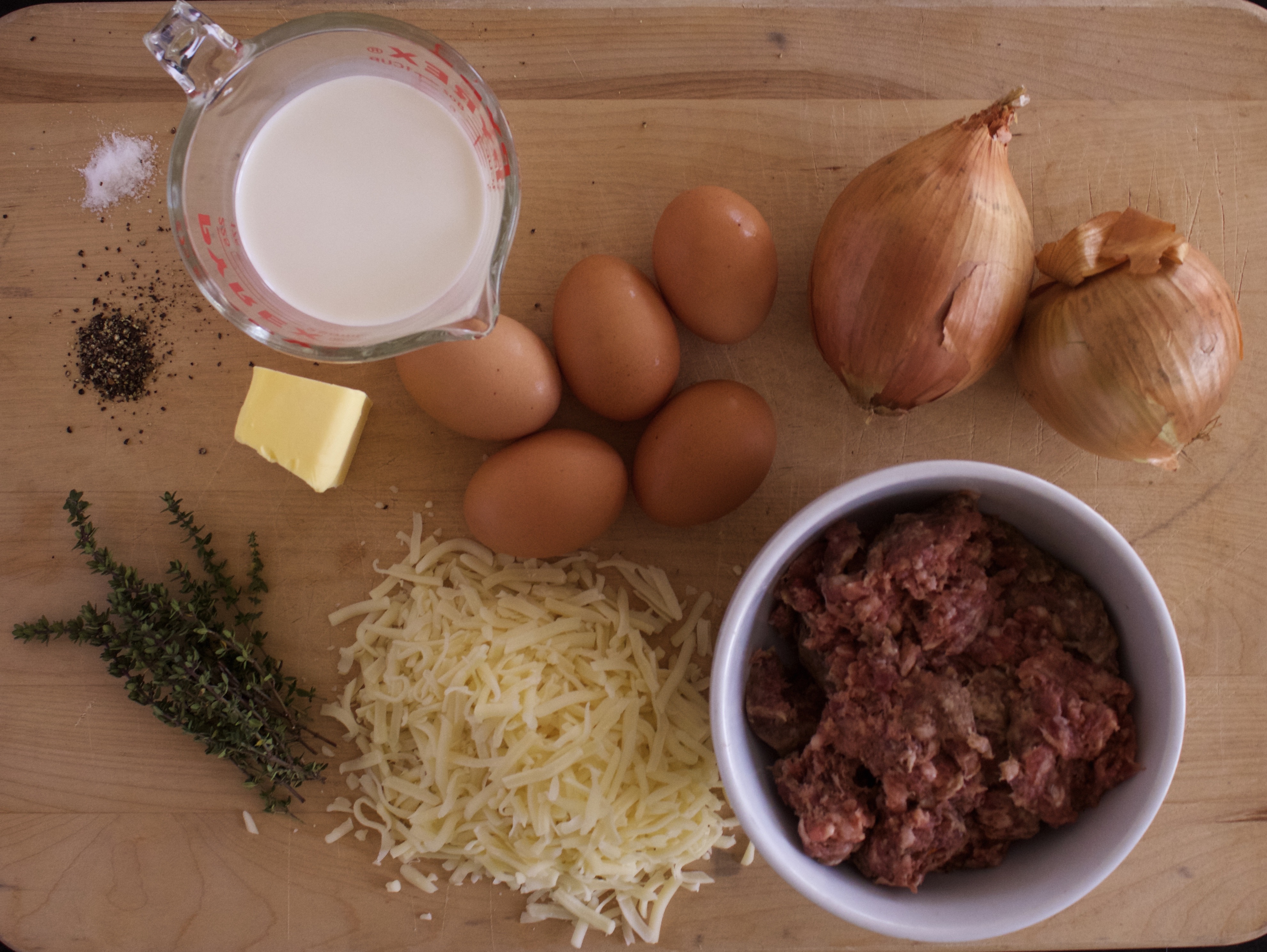 Photo of ingredients for low carb sausage, caramelized onion, and gruyere pie