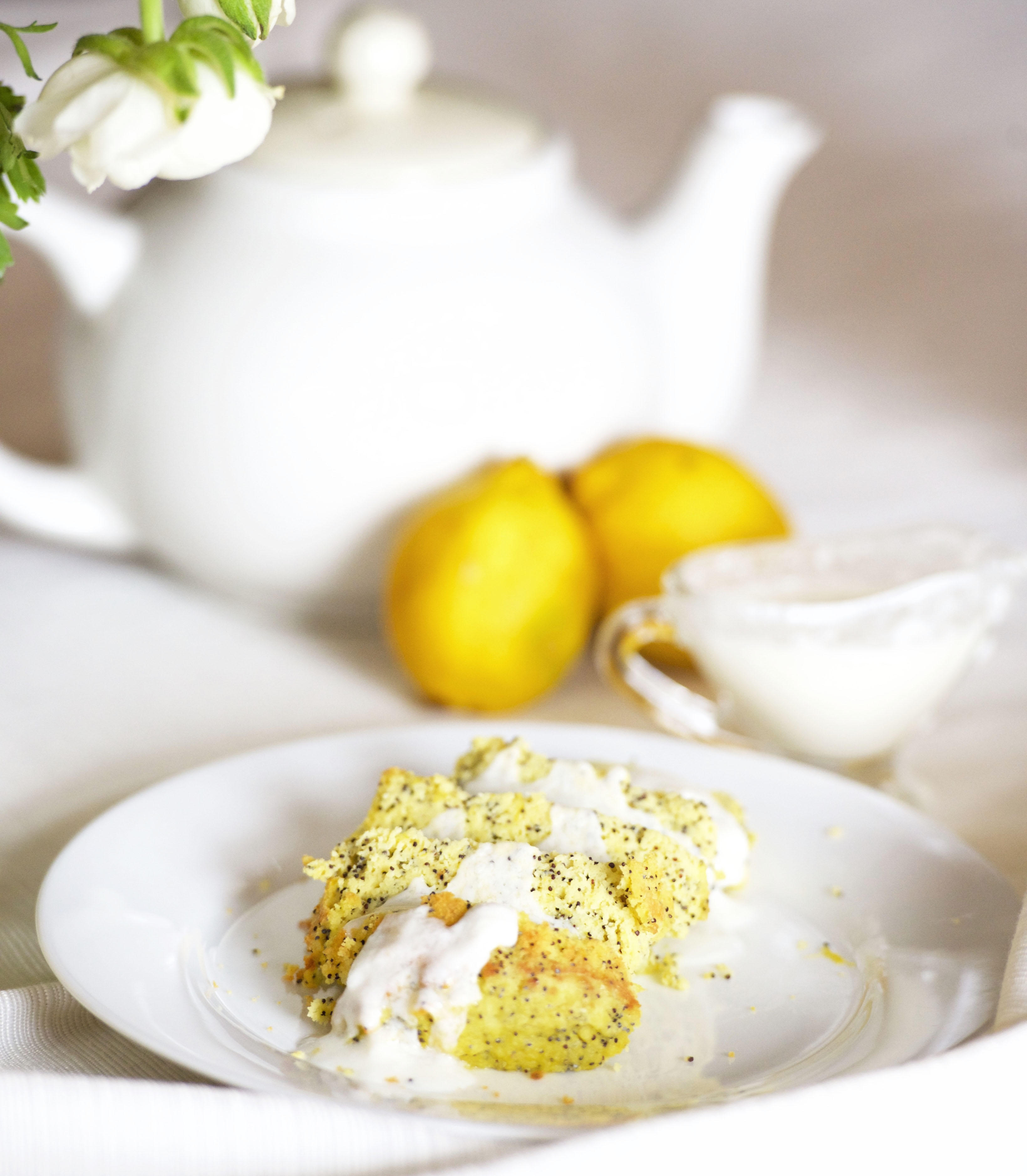 Photo of sliced Paleo Lemon Poppyseed Jar Cakes on a plate.
