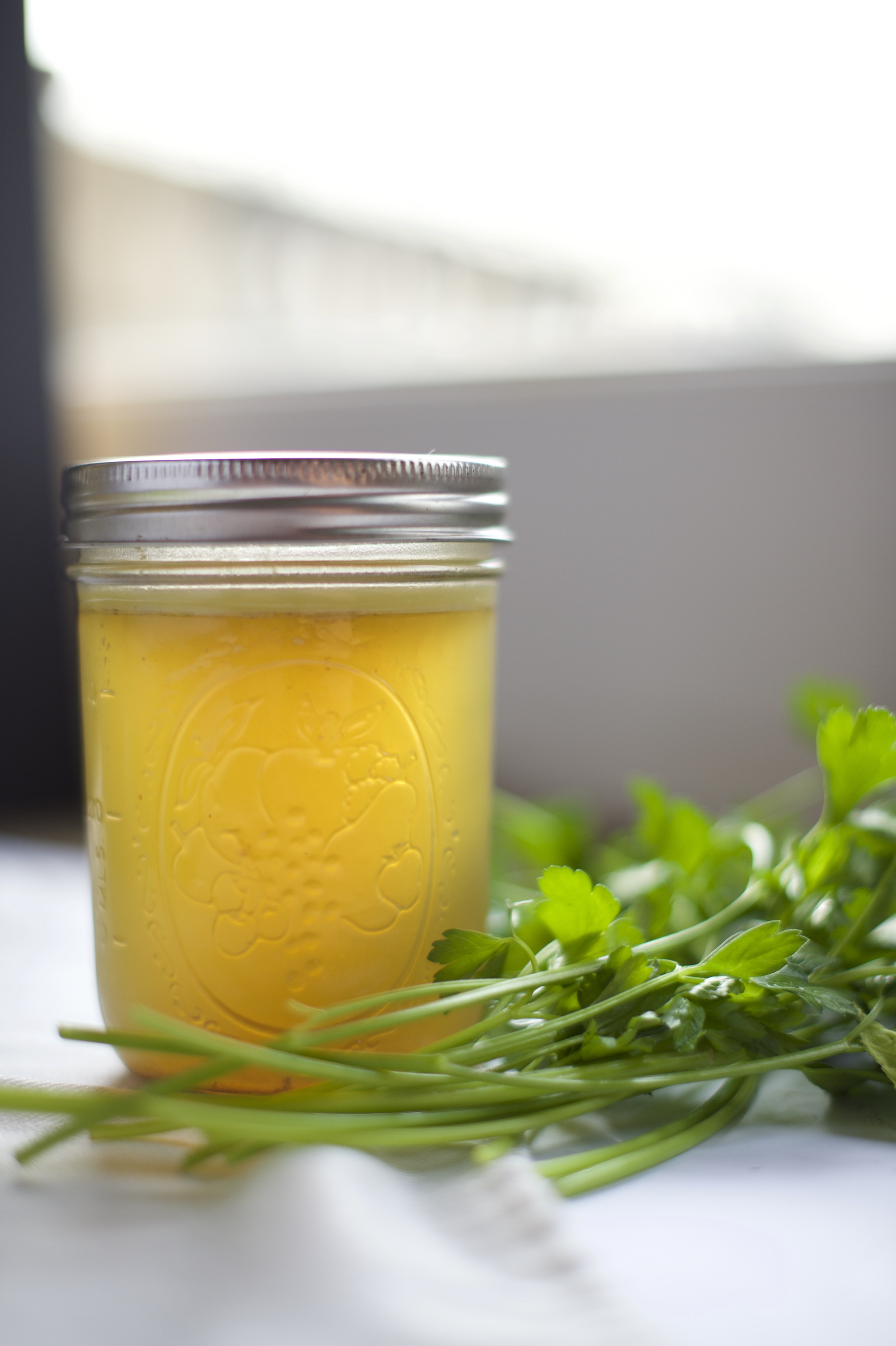 Photo of Classic Chicken Stock in a jar.
