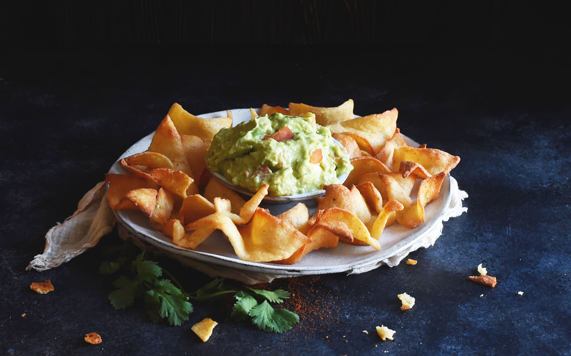 Low-Carb Tortilla Chips on a plate with guacamole