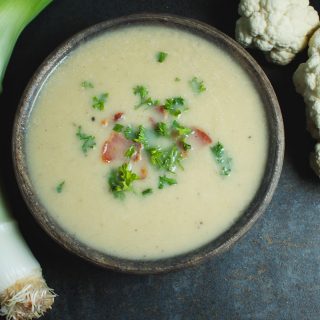 This soup is a Paleo, low-carb, and dairy-free comfort food. No one will know this soup is made with cauliflower and not potatoes. The thyme, bacon and leeks add extraordinary flavor to this velvety soup.