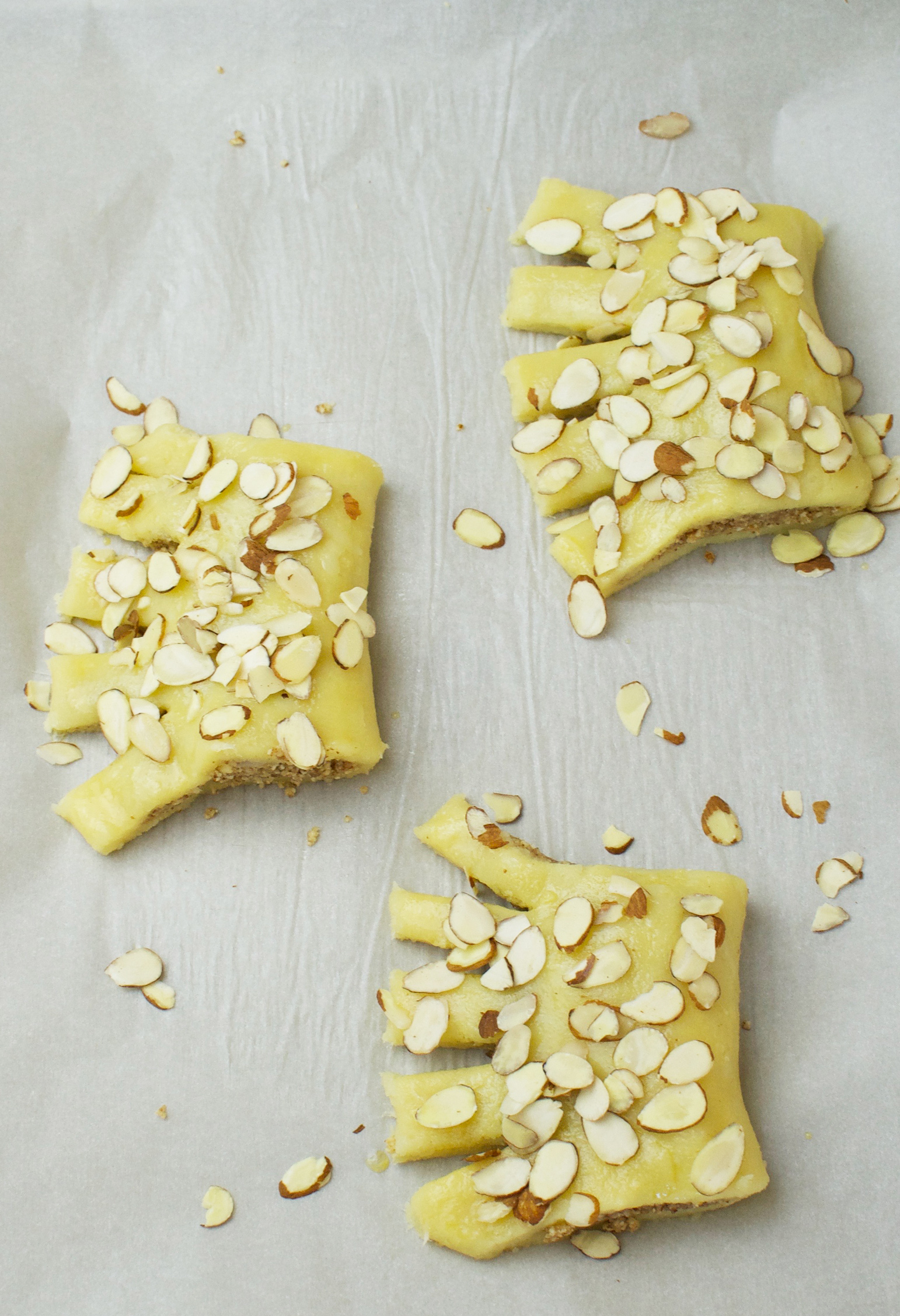 Bear claws with egg wash and almonds sprinkled on top