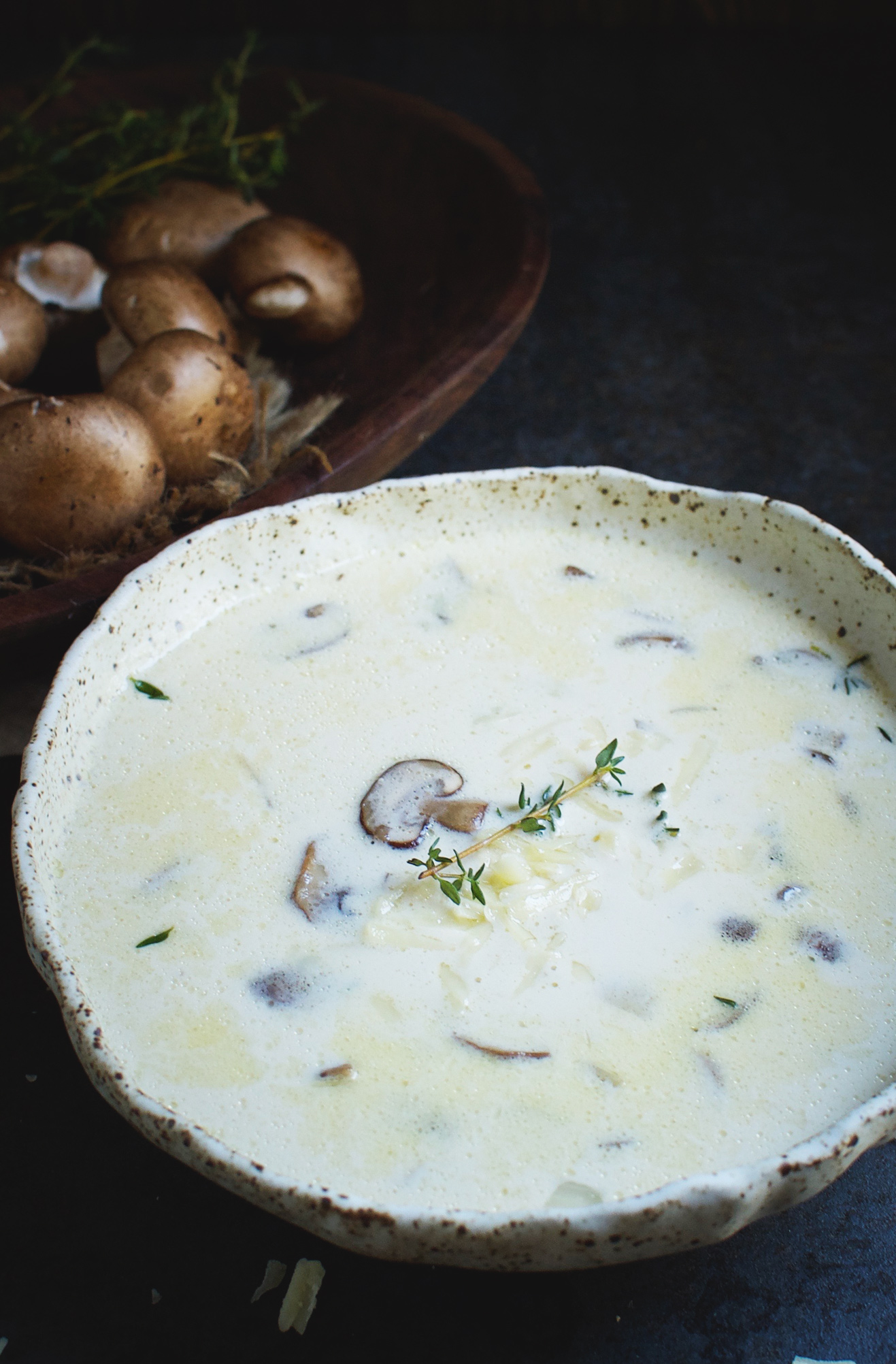 Low-Carb Cheese Soup with Mushrooms and Thyme in a bowl