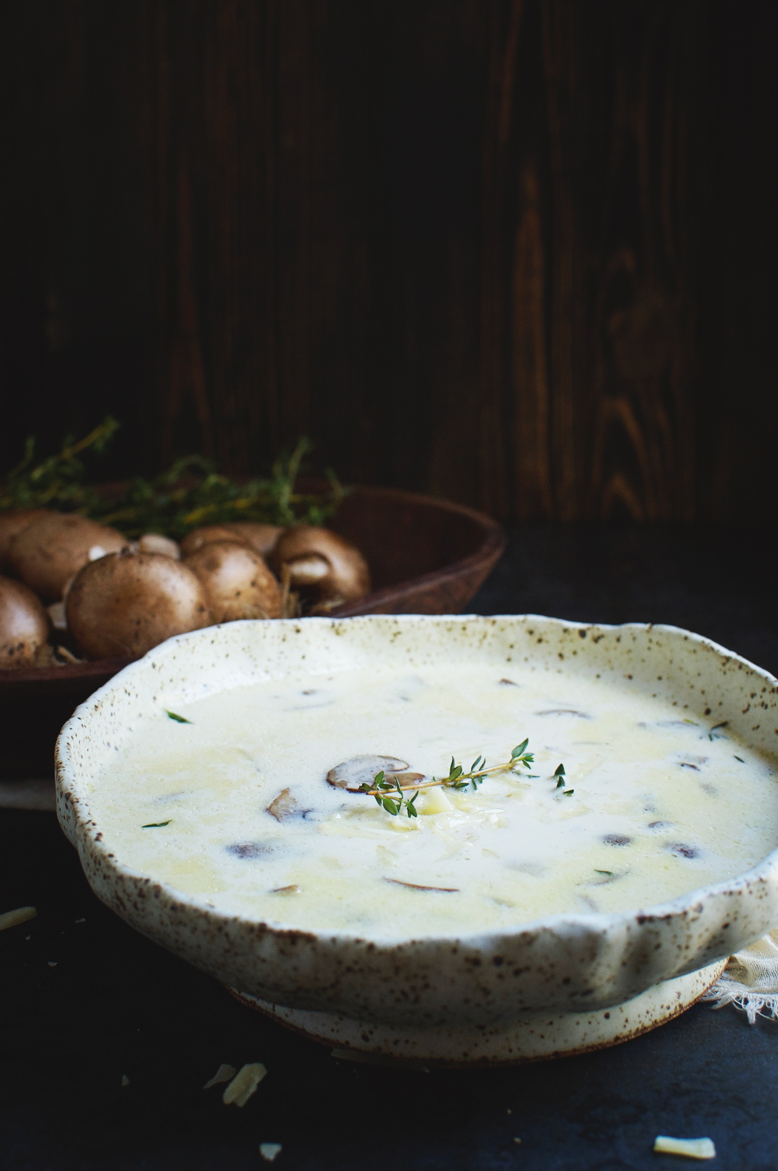 Low-Carb Cheese Soup with Mushrooms and Thyme in a bowl