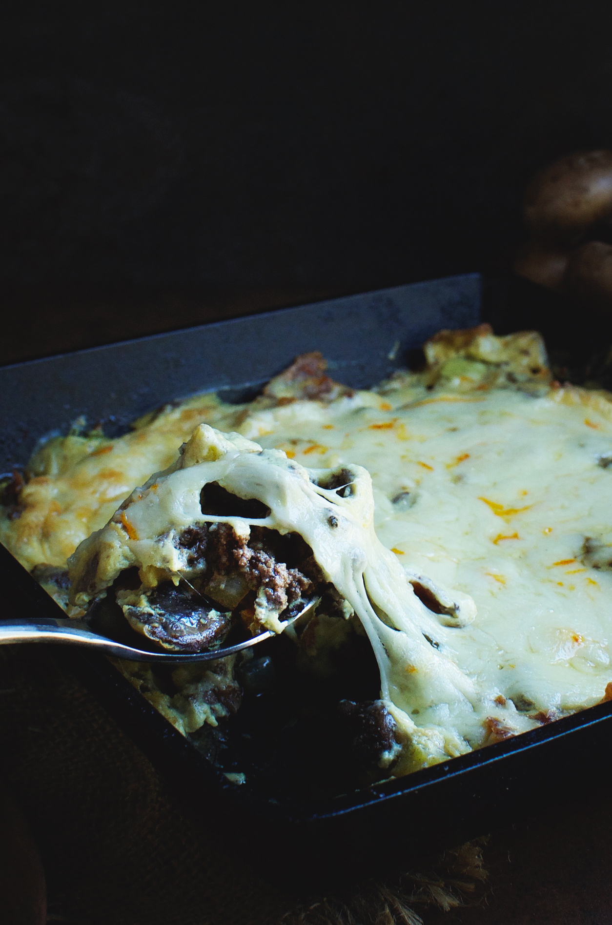 Serving the Ultimate Bacon Cheeseburger Casserole.