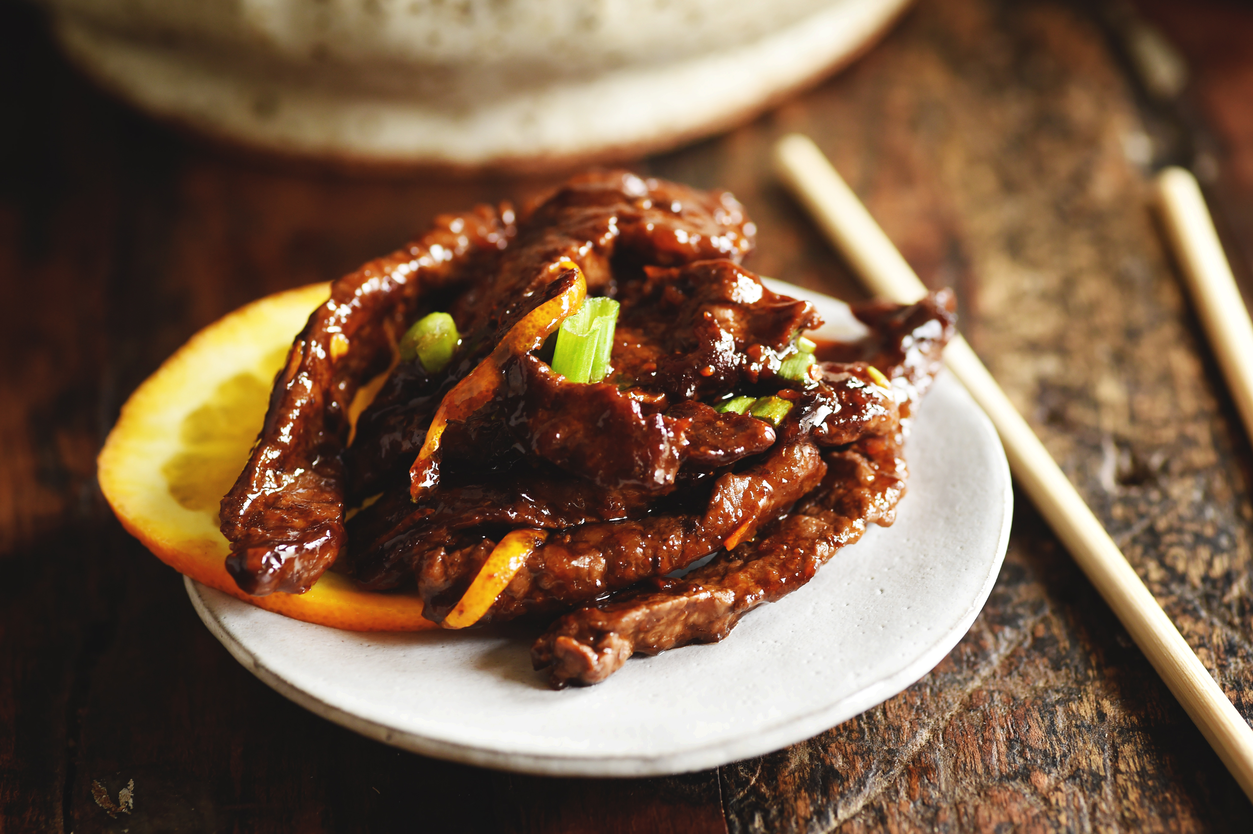 Orange Beef - Low-Carb Chinese Food Recipe served on a plate with chopsticks.