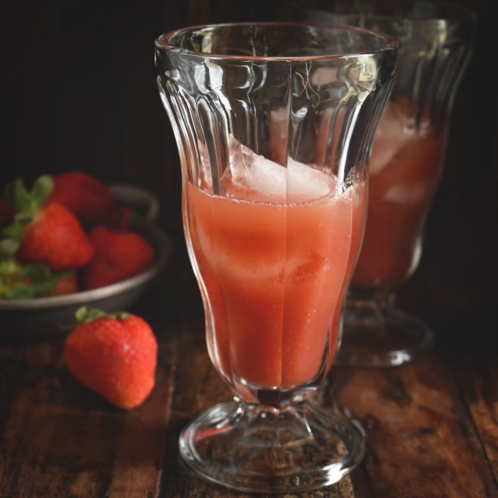 Low-Carb Strawberry Italian Cream Soda Recipe --pouring the strawberry syrup over the ice.