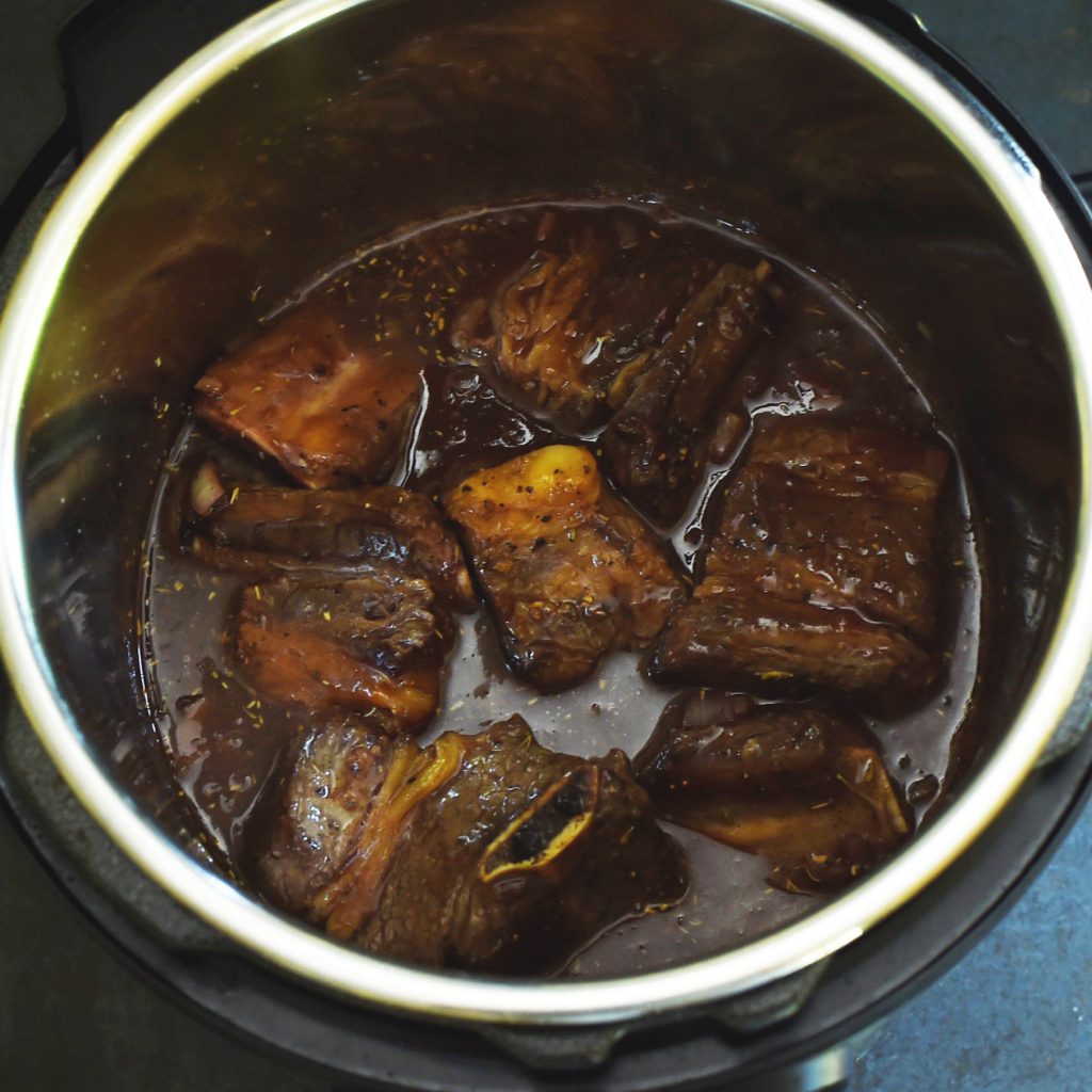 Instant Pot Low-Carb Short Ribs Recipe -with ribs added back into the pot.