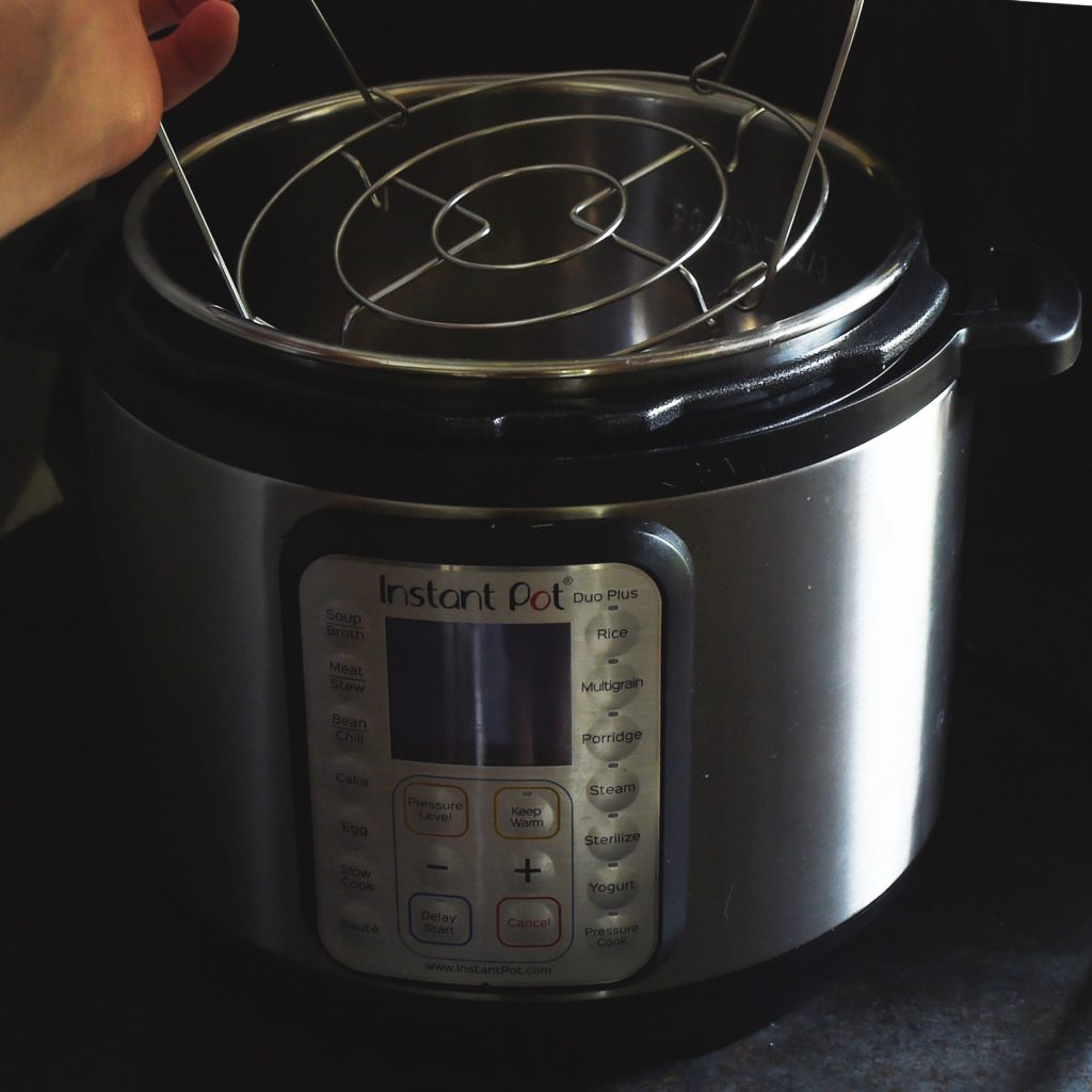 Instant Pot Spaghetti Squash-placing the steam grid in the pot.