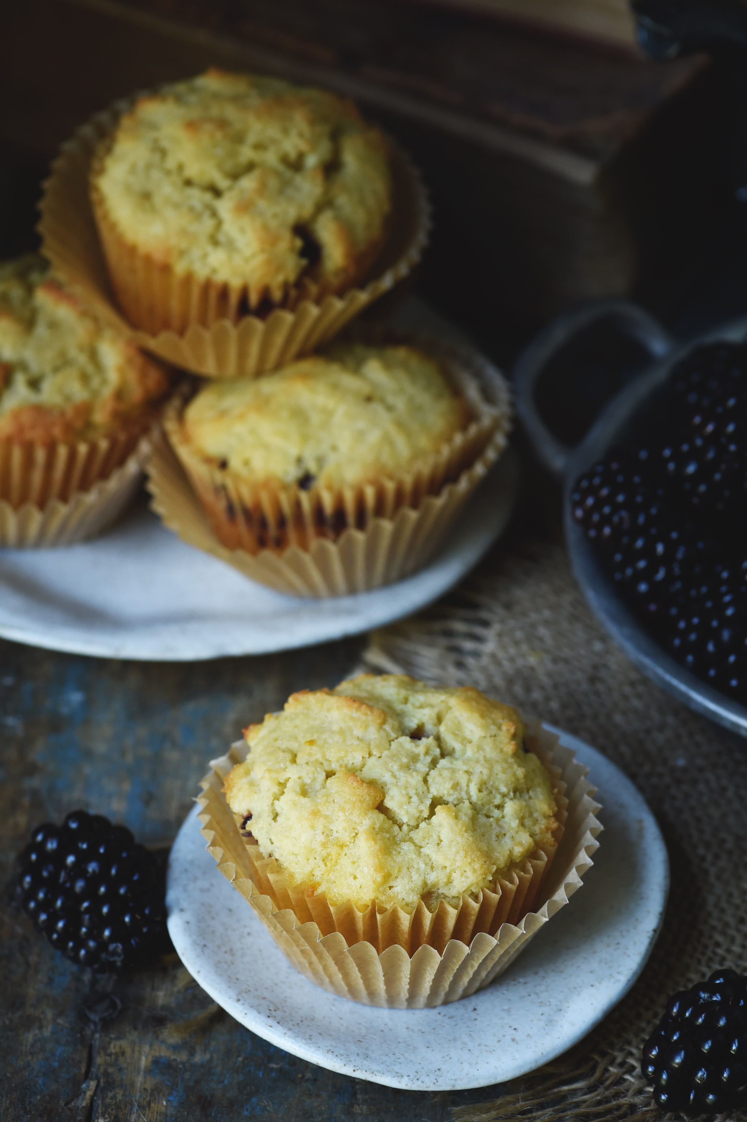 Low-Carb Blackberry-Filled Lemon Almond Flour Muffins-on a serving plate