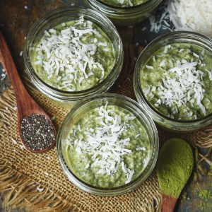 Low-Carb Coconut Matcha Chia Pudding Recipe-in dishes garnished with coconut.