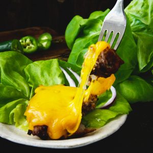 Low-Carb Easy Grilled Jalapeño Burgers-Bite shot for recipe.