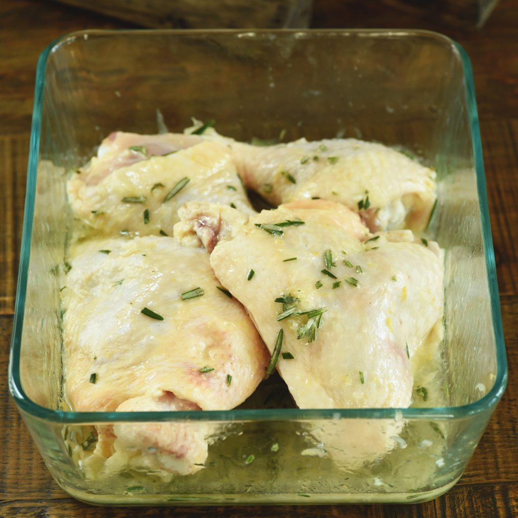 Grilled Rosemary Lemon Chicken -Chicken pieces in the marinate.