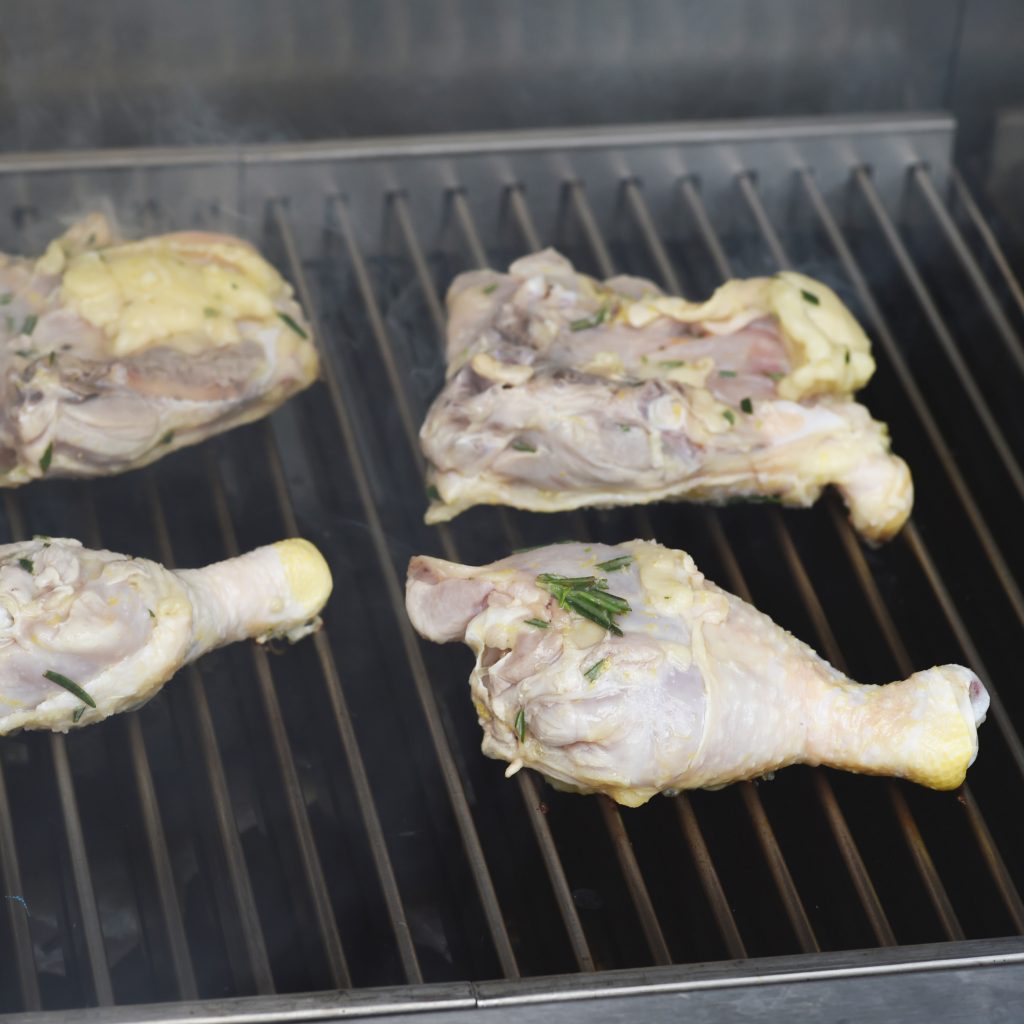 Grilled Rosemary Lemon Chicken -Skin side down on the grill.