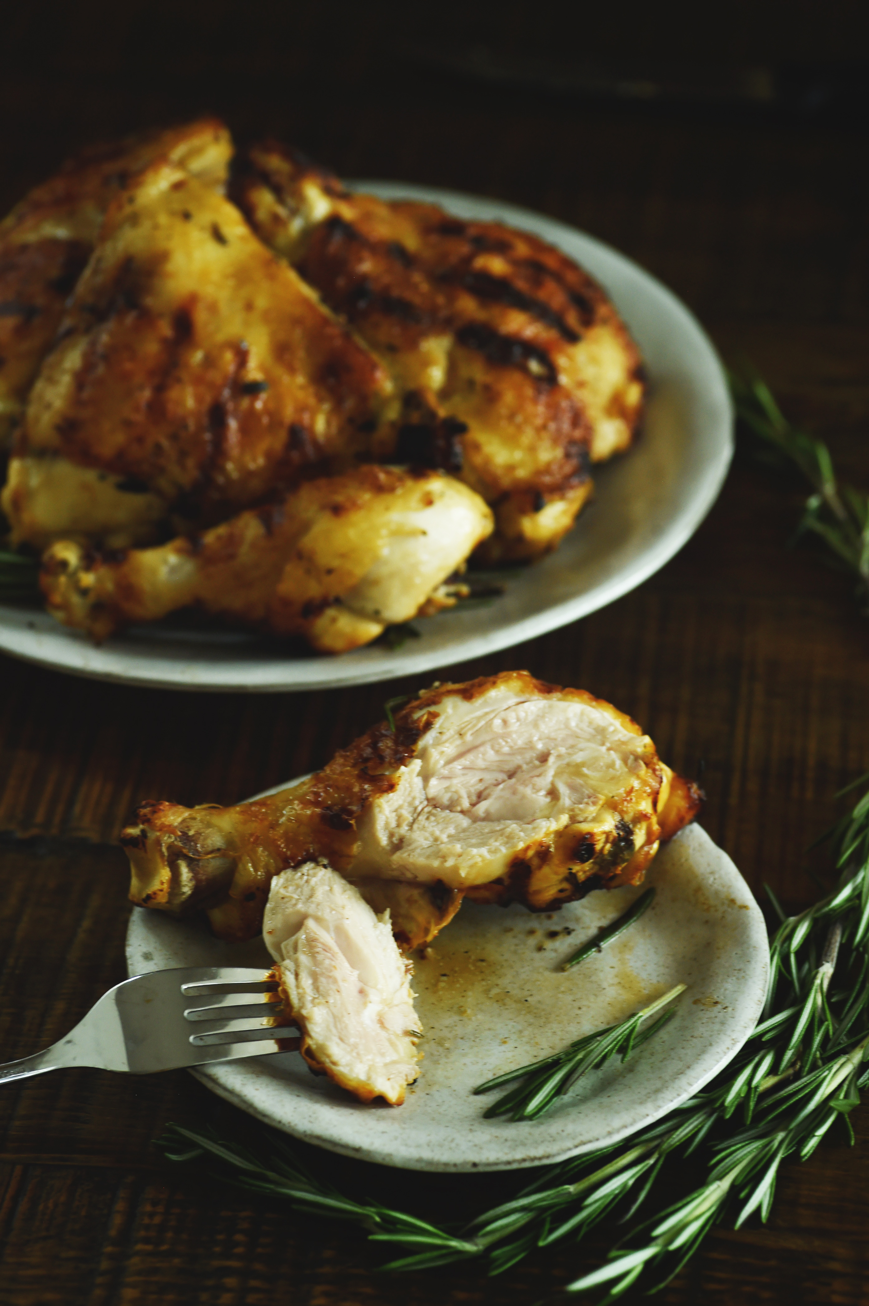 Grilled Rosemary Lemon Chicken -Cutting into a drumstick.