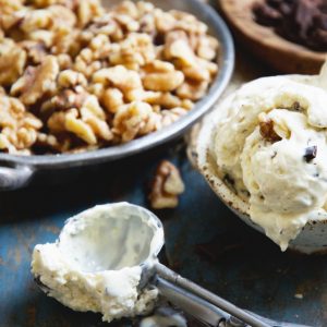 Keto-Friendly Chunky Monkey Ice Cream-In a bowl with scoop beside it.