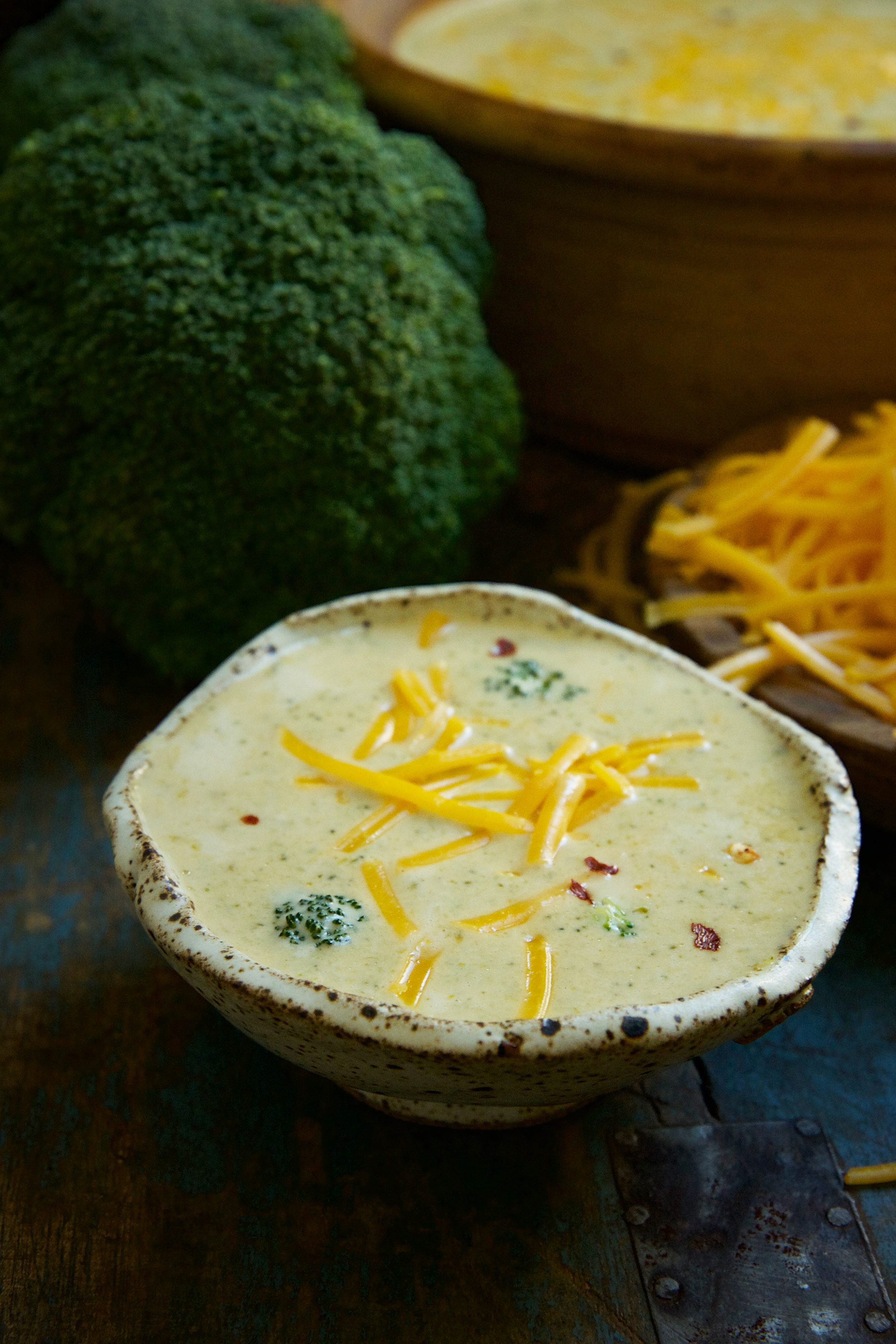Low-Carb Broccoli Cheddar Soup Recipe-garnished with cheese.