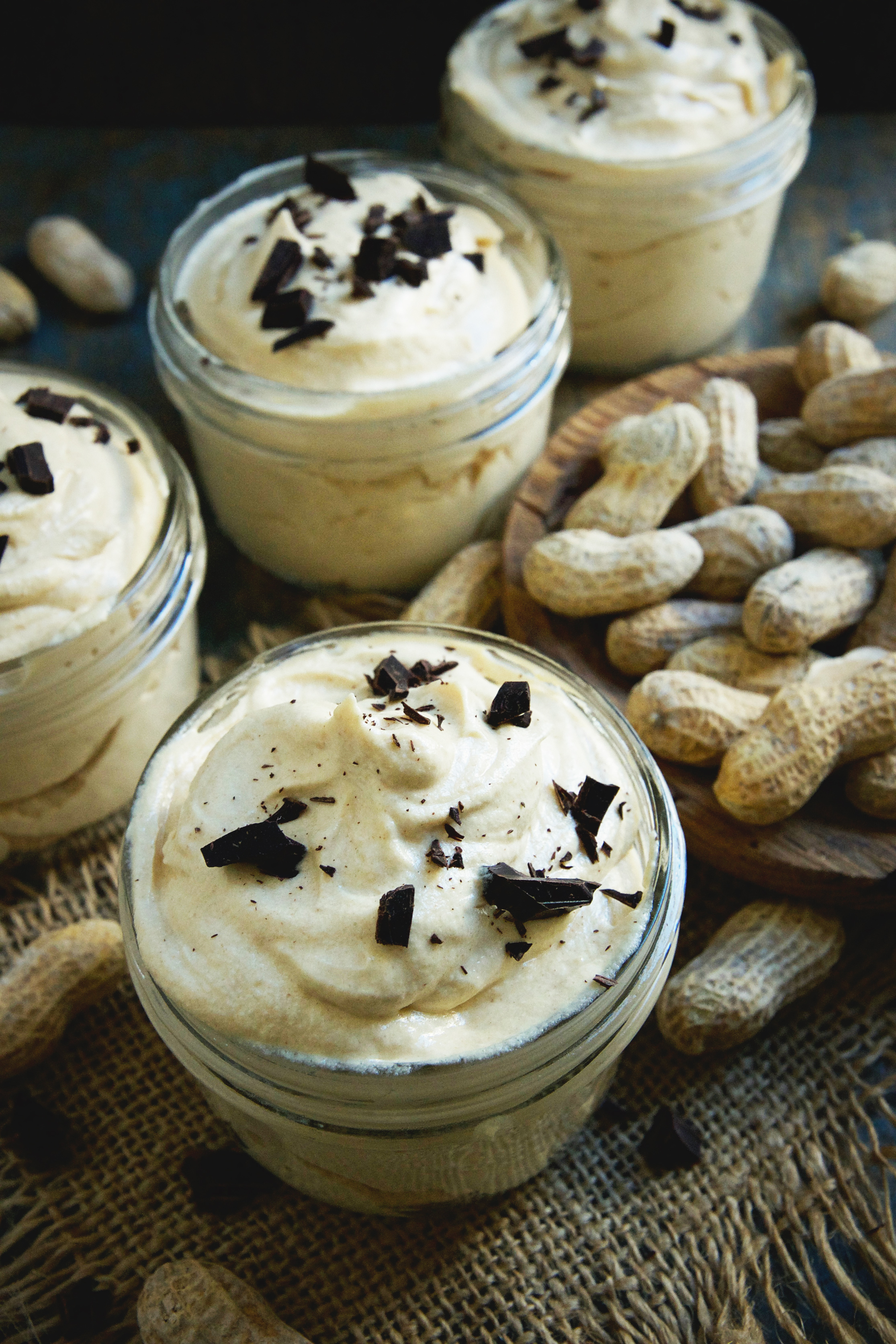 Keto-Friendly Low-Carb Peanut Butter Mousse-with peanuts in the background.