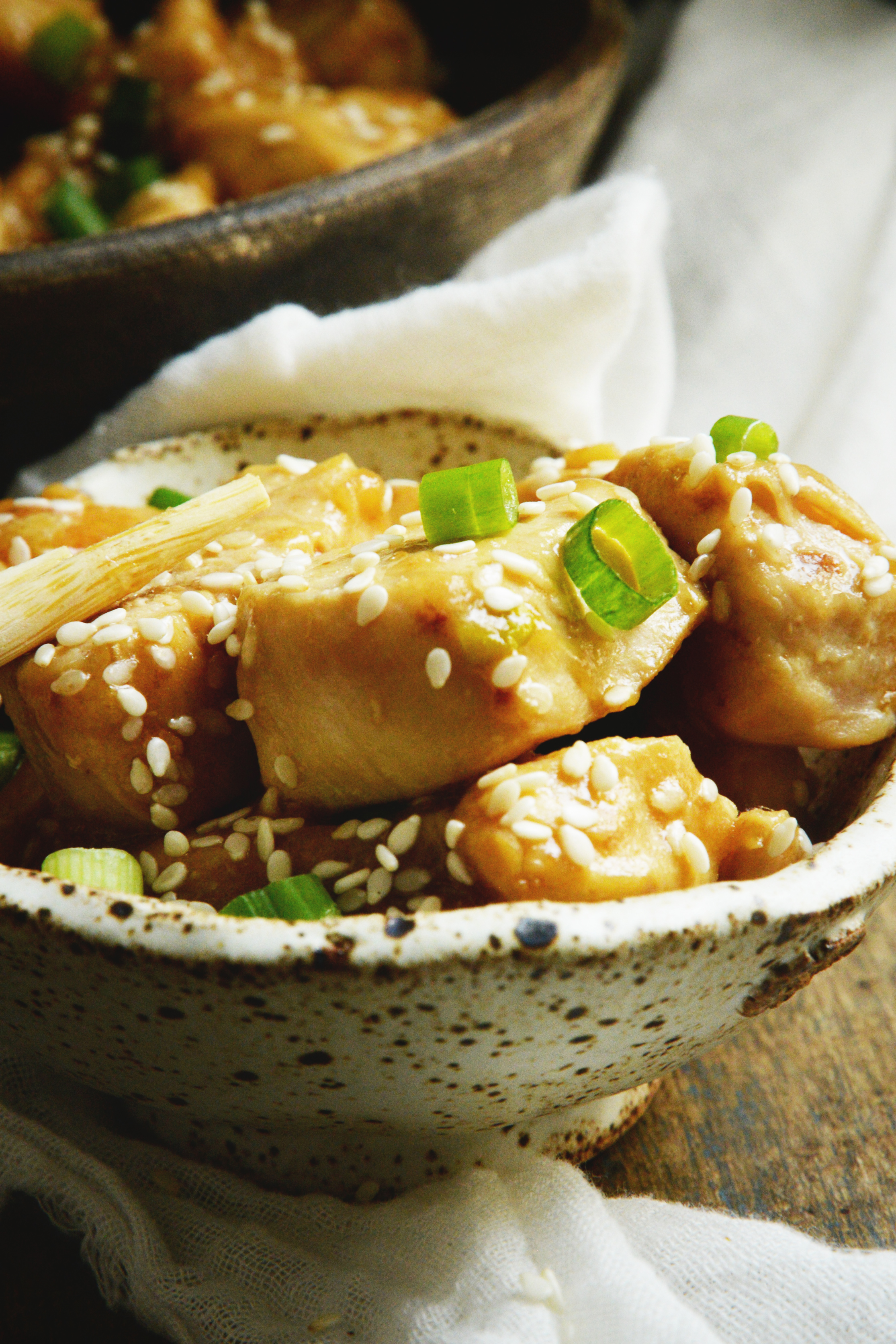 Easy Low-Carb Sesame Chicken Recipe-topped with green onion and sesame seeds.