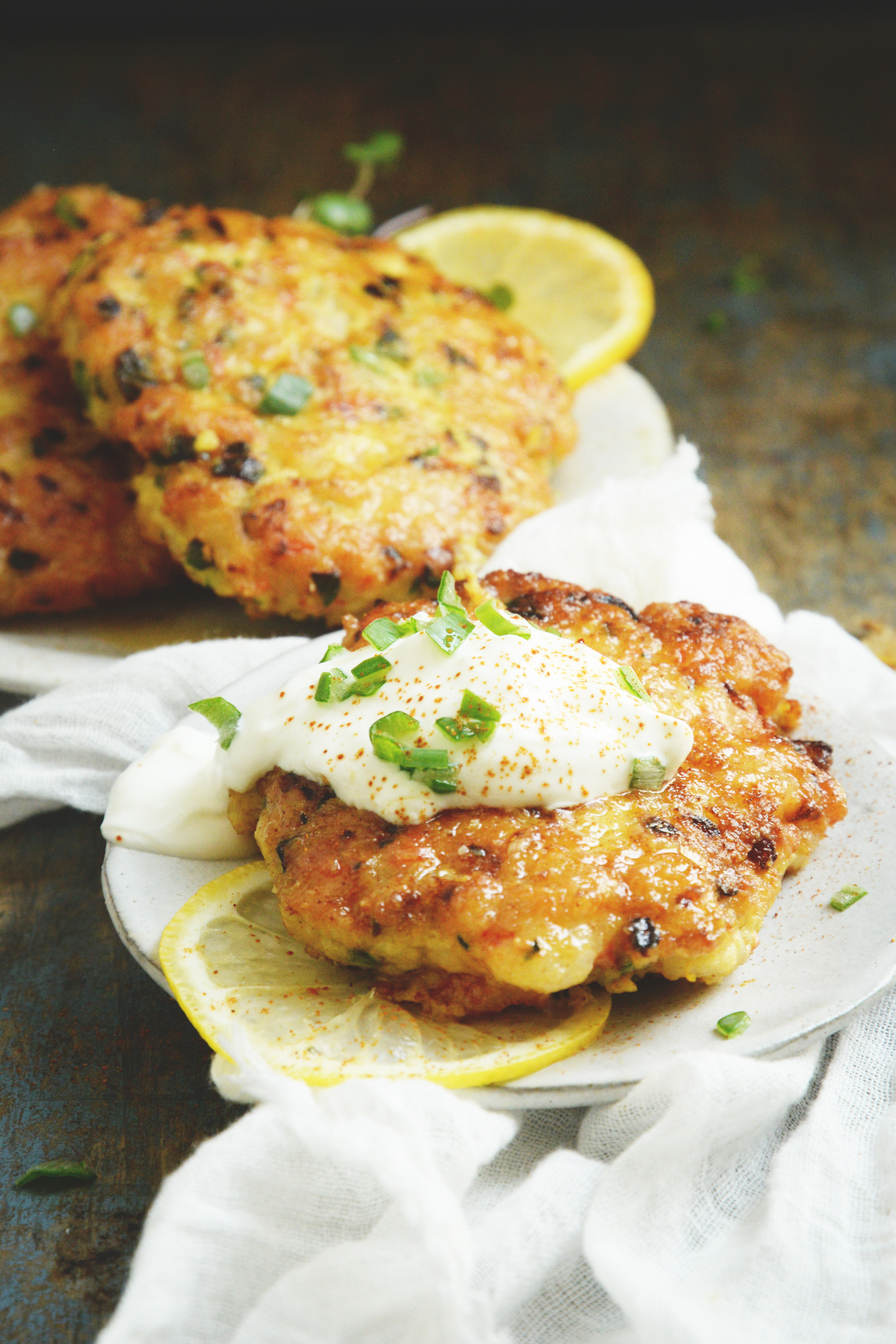Shrimp Cakes Recipe-low-carb and keto-friendly-garnished with sour cream and green onions.