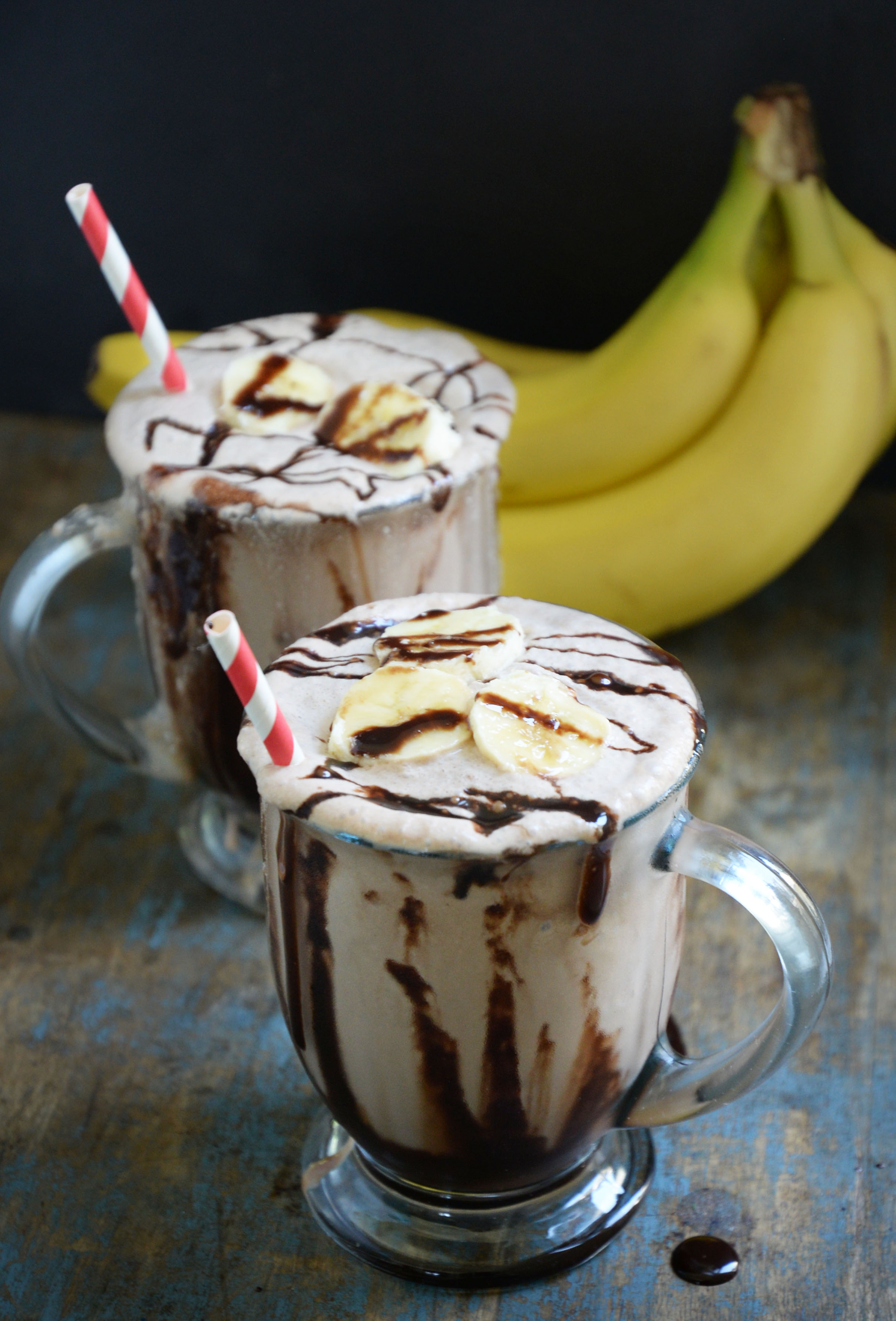 Low-Carb Banana Chocolate Milkshake -garnished with bananas and chocolate syrup.