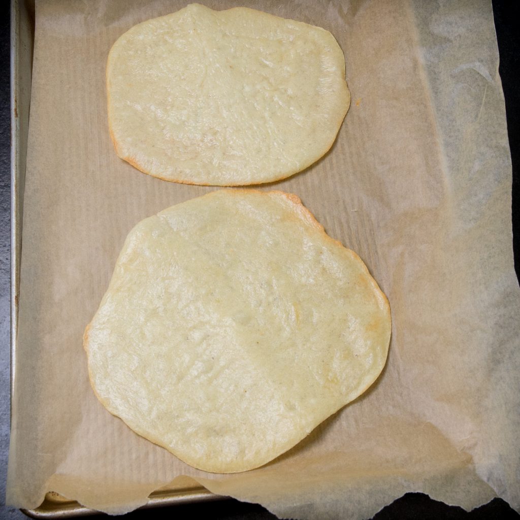 Photo of baked tortillas on a tray.