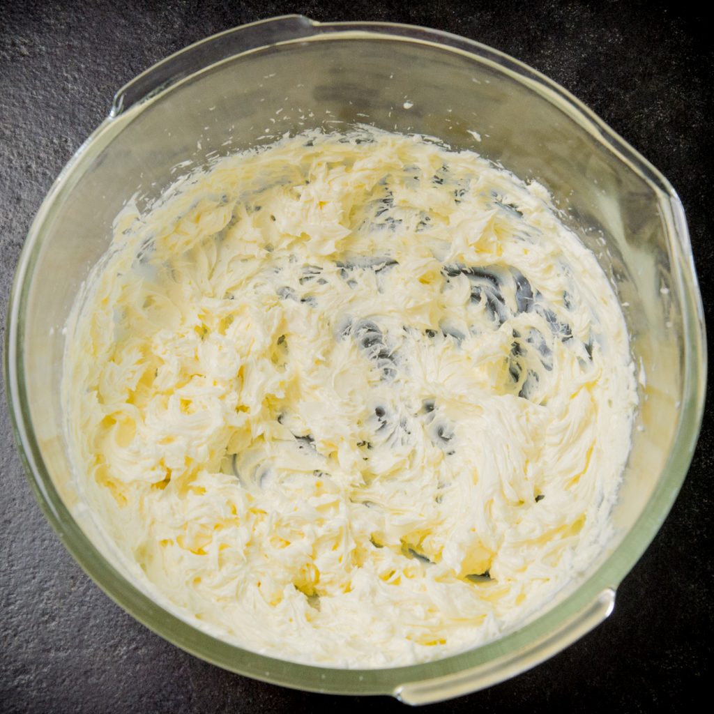 Whipping the cream cheese and butter together.