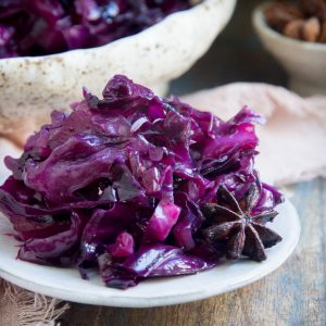Close up photo of Low-Carb Sweet and Sour Red Cabbage on a serving plate.