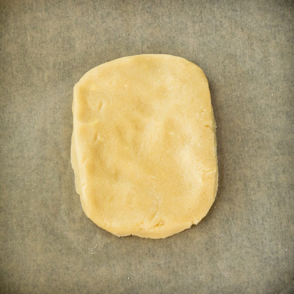 Patting the dough into a rectangle.
