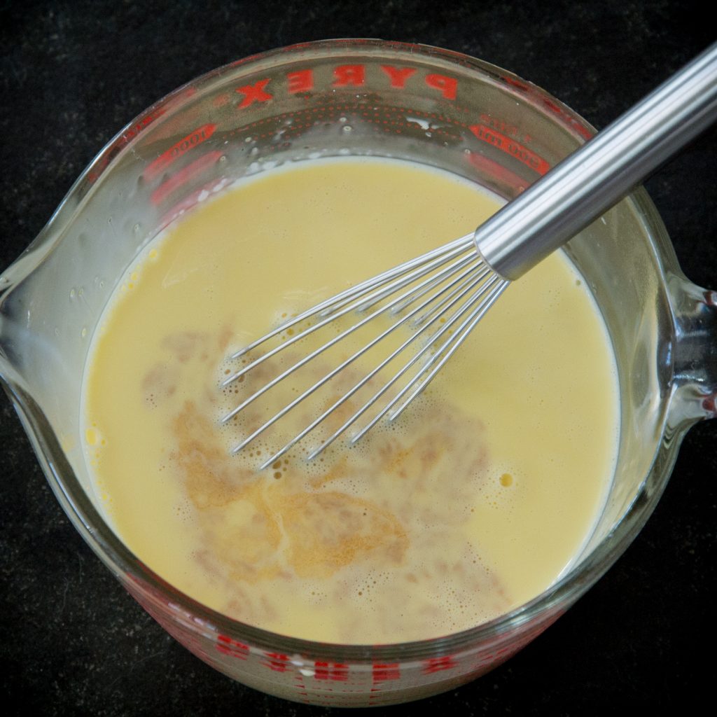 Adding vanilla into the mixture.