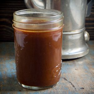 Close up photo of Keto Caramel sauce in a Mason jar.