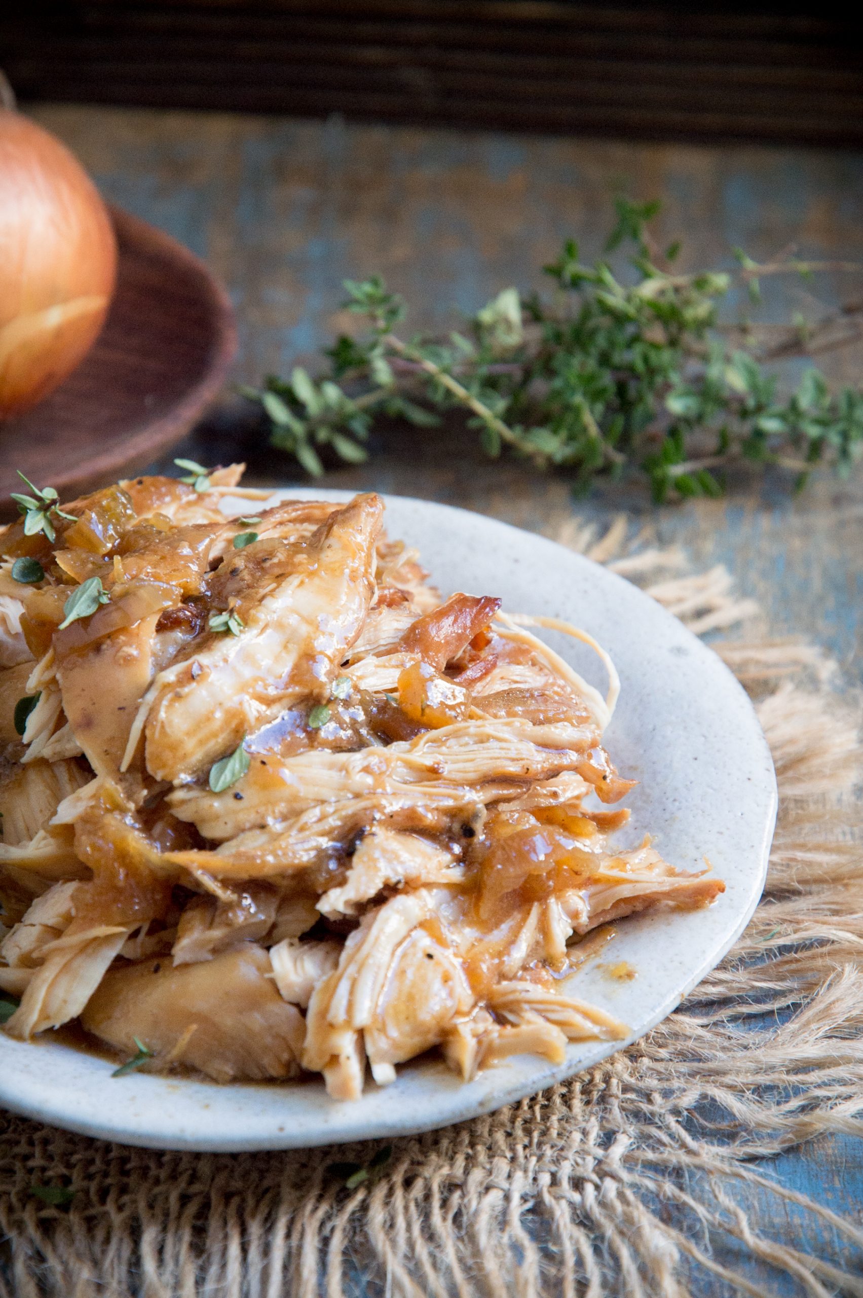 Easy Keto-Friendly Crockpot Chicken garnished with thyme.