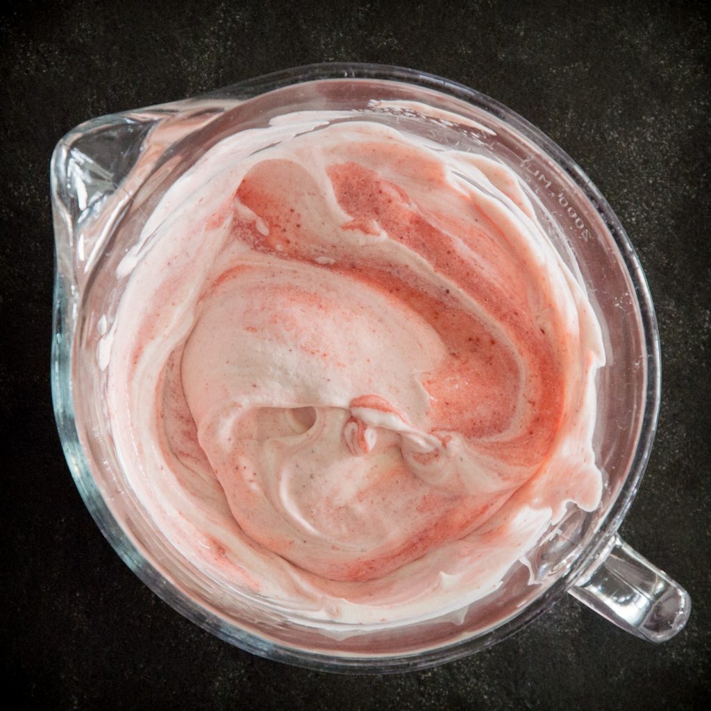 Strawberry-gelatin mixed with whipped cream.