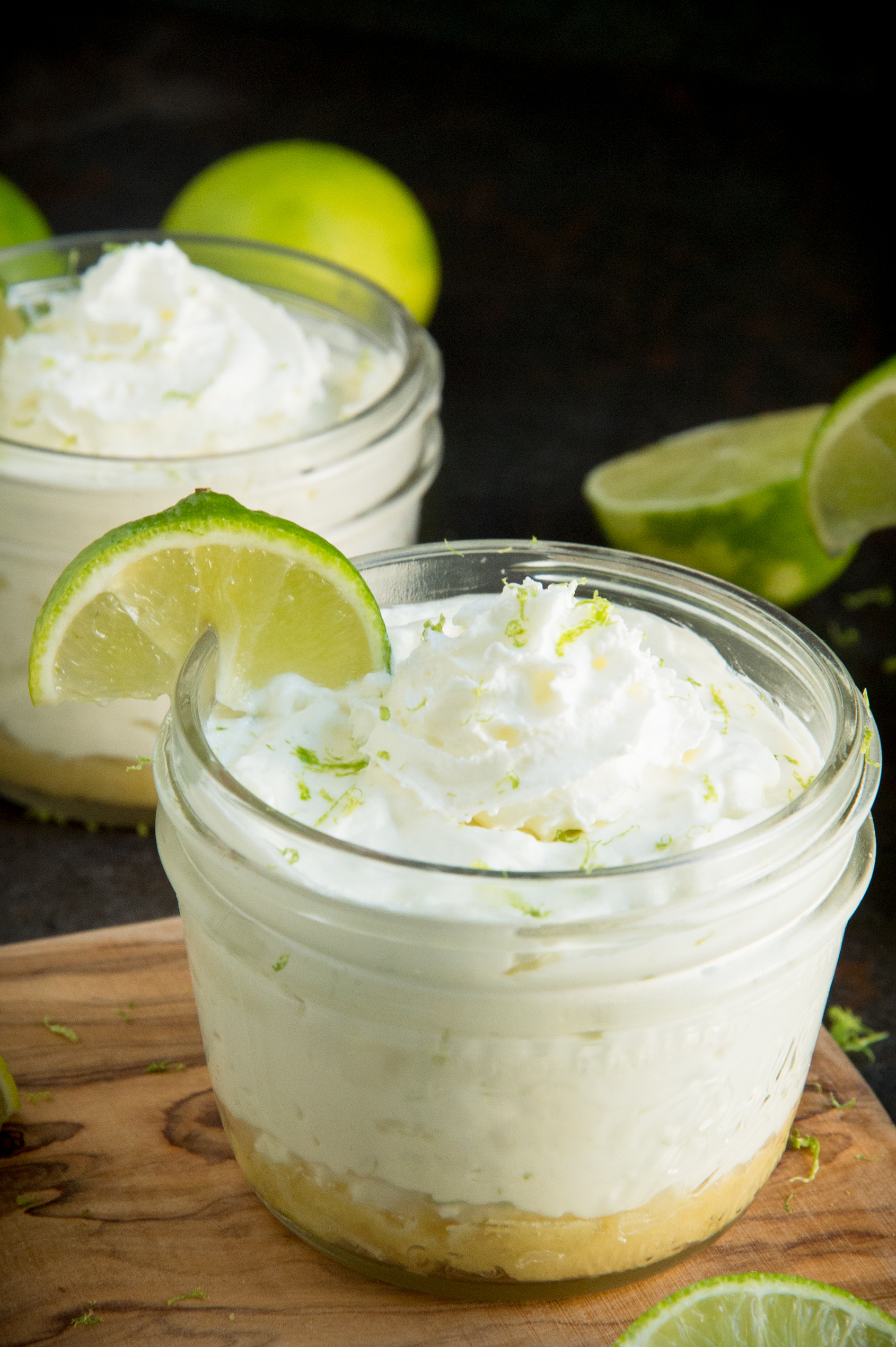 Keto key lime cheesecakes garnished with zest