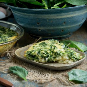 Recipe image of Crustless Spinach Quiche on a plate.