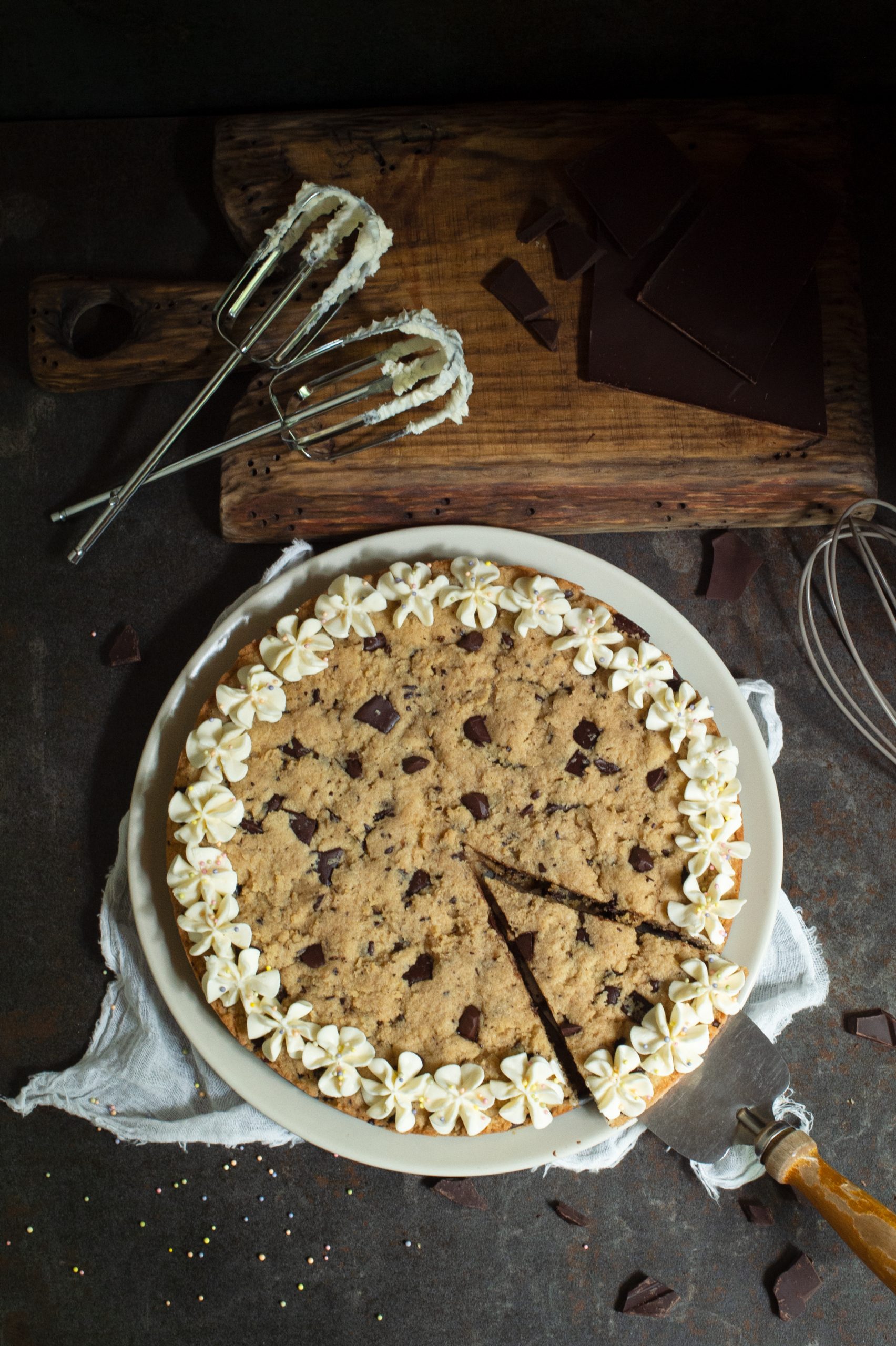 Overhead photo of slice of Keto cookie cake being lifted with a pie cutter