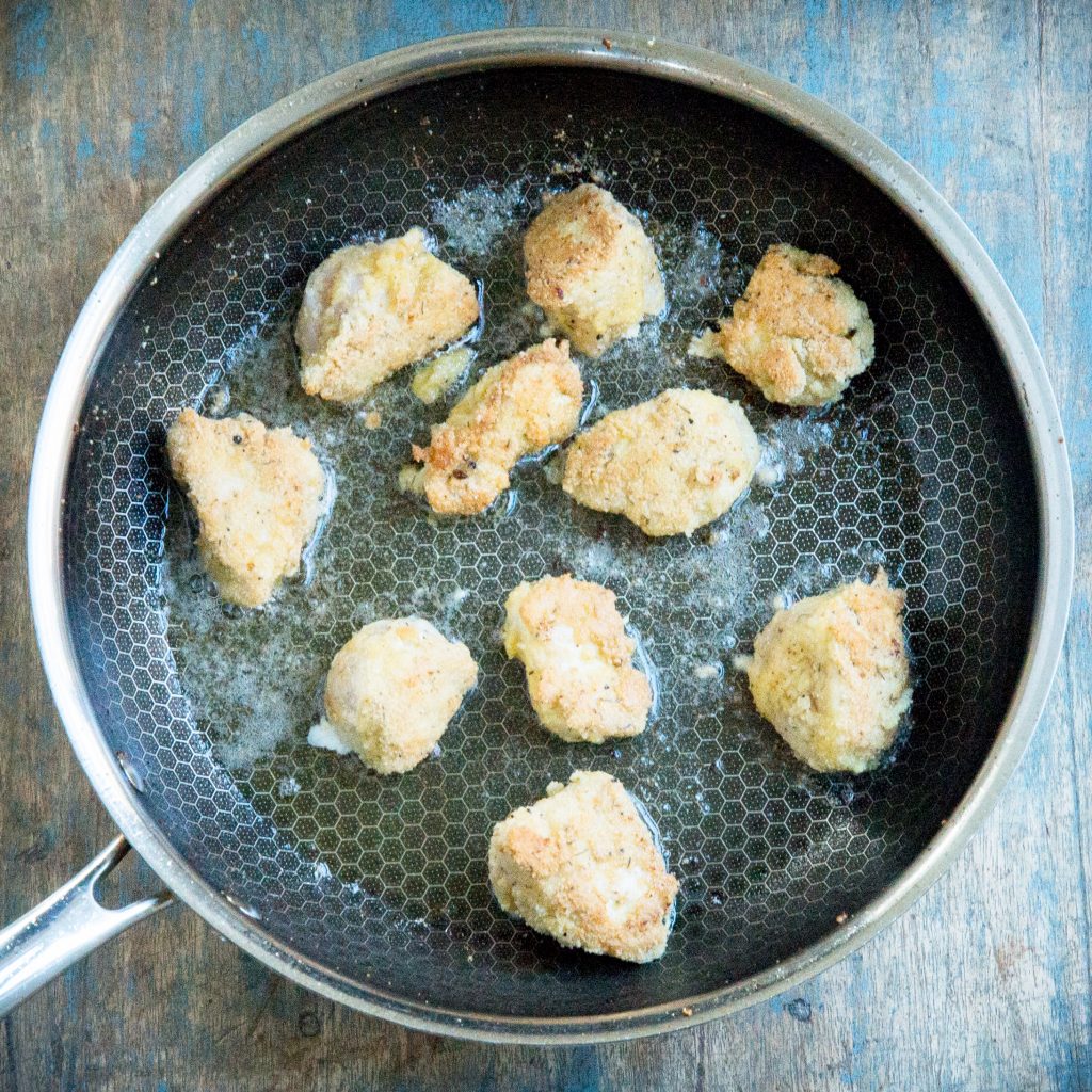 Frying the keto chicken nuggets.