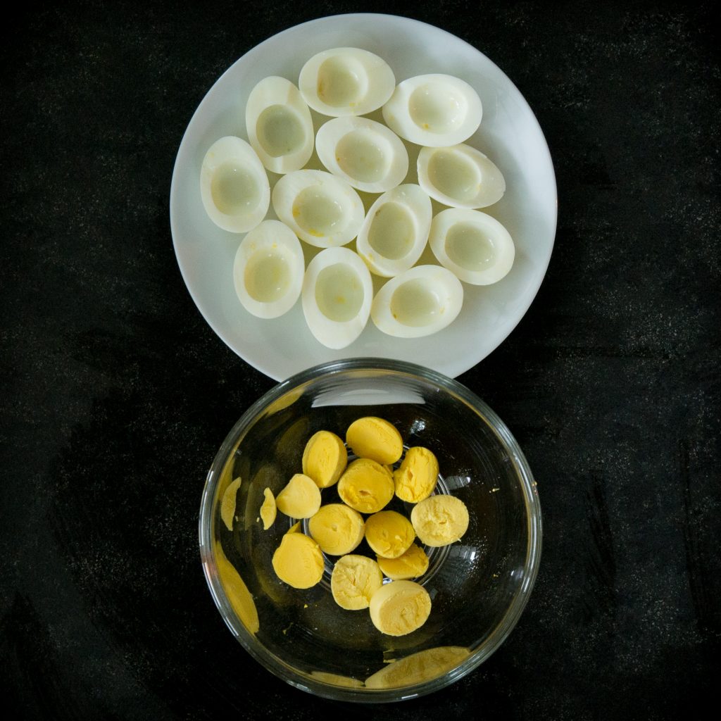 Sliced eggs with yolks removed.
