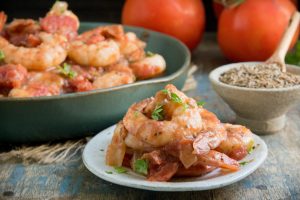 Keto Spicy Shrimp and tomatoes served on a plate.