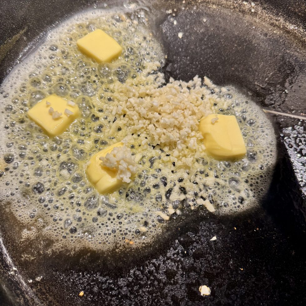 Butter and garlic cooking in pan