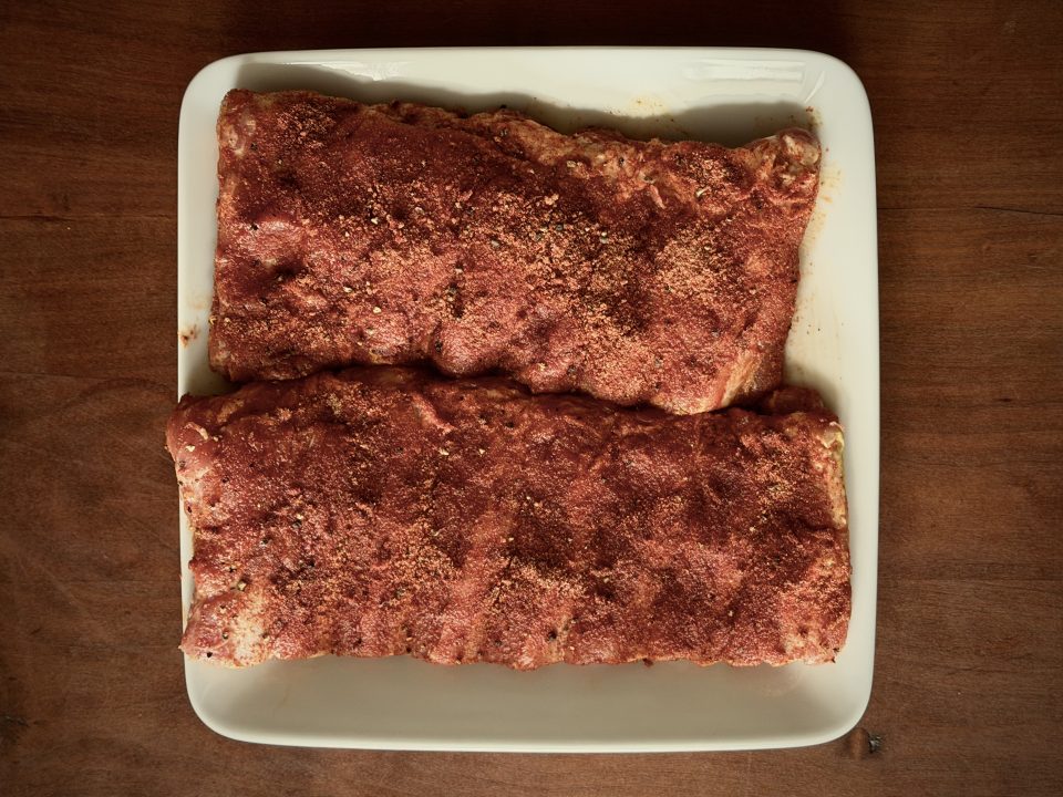Raw Ribs covered in dry rub