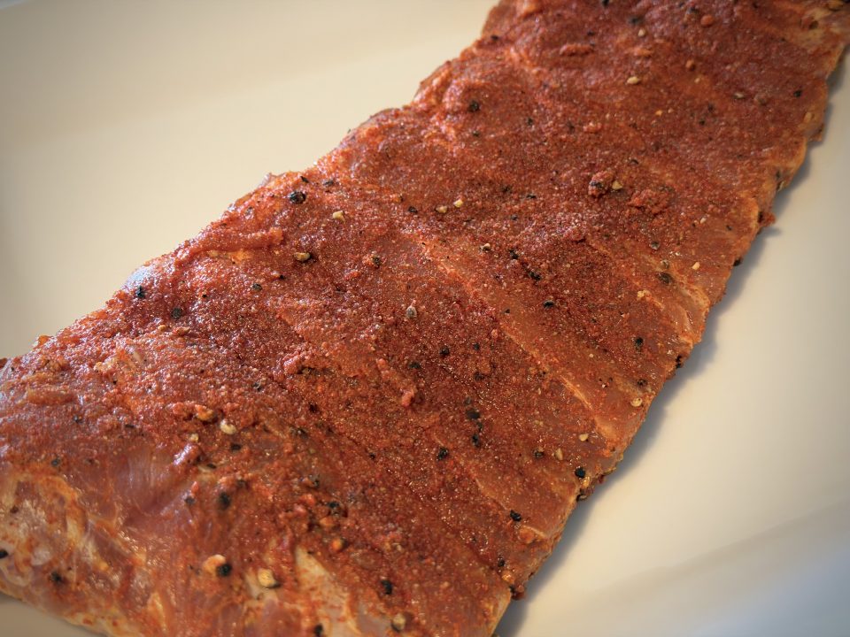 Rack of ribs after marinating for 12 hours. The dry rub is wet and pasty