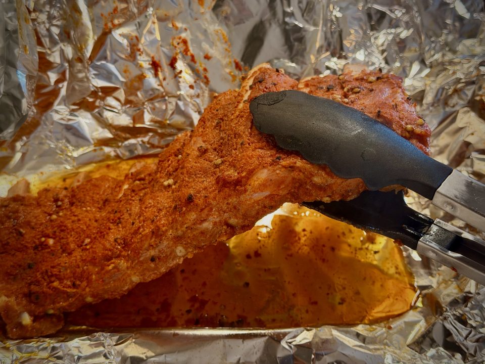Cooked Ribs bowing at an 80 degree angle when held with tongs